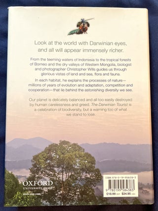 THE DARWINIAN TOURIST; Viewing the World through Evolutionary Eyes / With Photographs by the Author