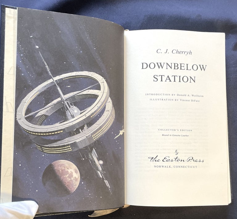 Item #9094 DOWNBELOW STATION; C. J. Cherryn / Introduction by Donald A. Wollheim / Artwork by Vincent DiFate / Collector's Edition Bound in Genuine Leather. C. J. Cherryh.