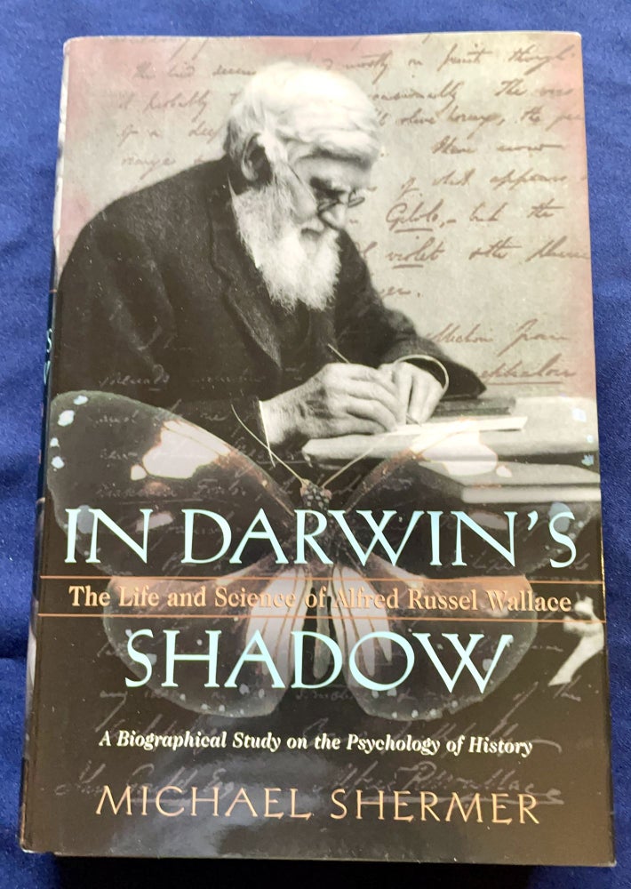 Item #9395 IN DARWIN'S SHADOW; The Life and Science of Alfred Russel Wallace / A Biographical Study on the Psychology of History. Michael Shermer.